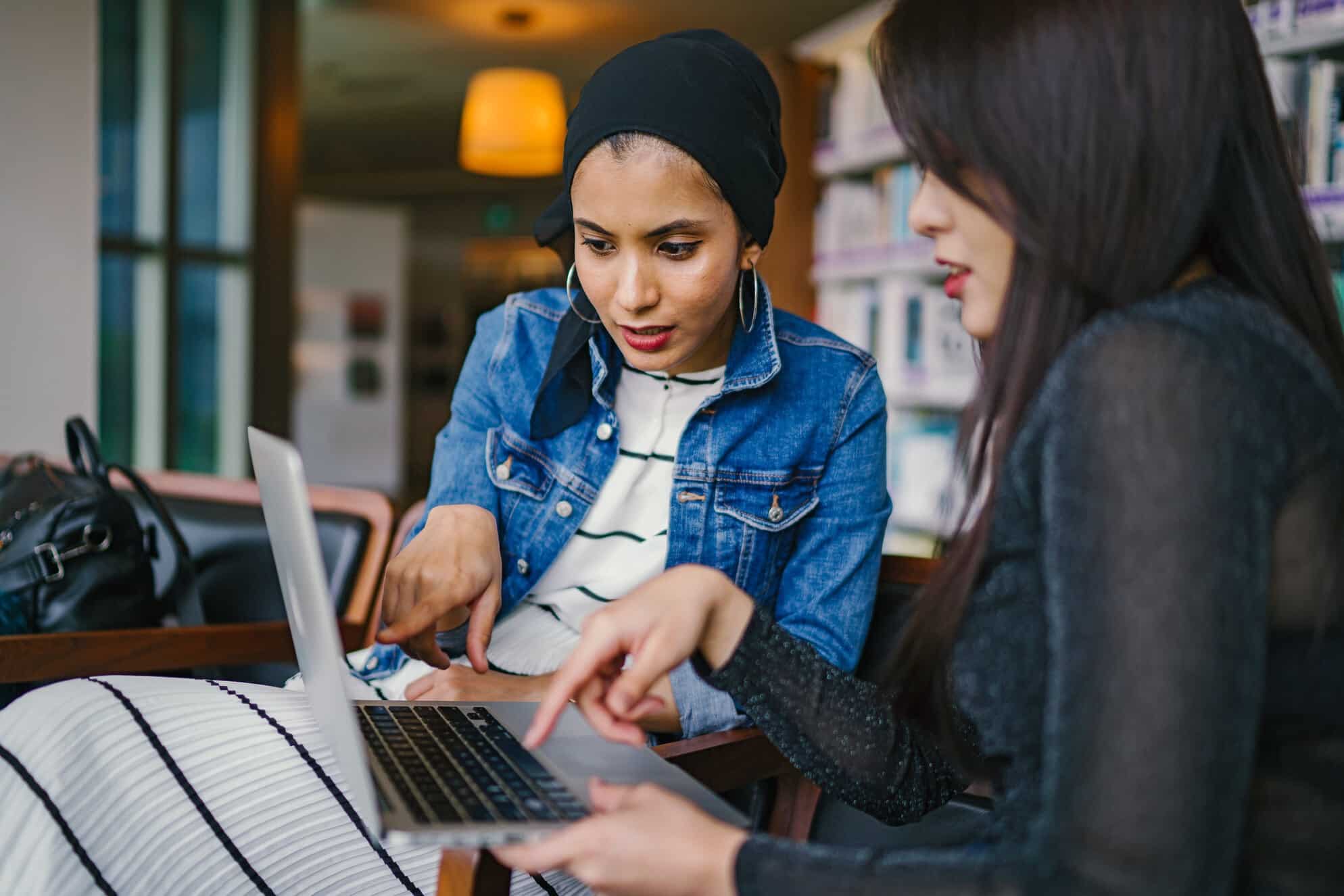 two small business owners looking at a computer