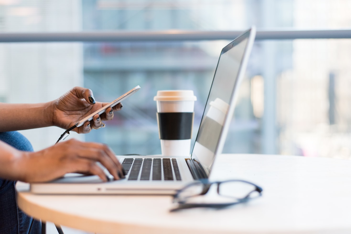 woman typing on laptop